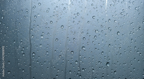 Raindrops on Glass Surface Showcasing Details and Serene Weather Elements