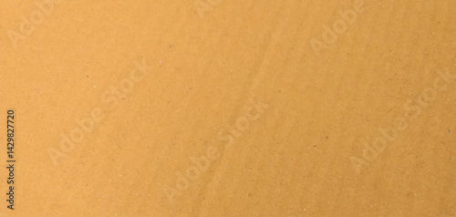Cardboard sheet texture background, pattern of brown kraft paper with vintage style. It is a background material of a light yellow craft board.