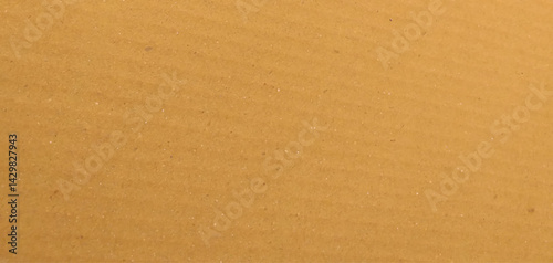 Cardboard sheet texture background, pattern of brown kraft paper with vintage style. It is a background material of a light yellow craft board.