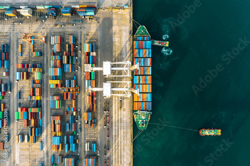 123456Next
Top view of a large cargo ship loading and unloading containers at a deep-sea port. This aerial scene highlights global logistics, international trade, and maritime transportation hubs.
