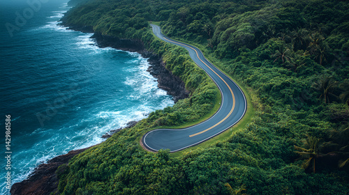 A stunning drone shot of winding coastal roads along the cliffside, hugging the shore with the ocean in the distance, leaving copy space for travel, adventure, or scenic route text.
 photo