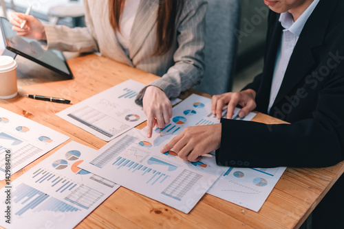 Strategic business meeting analyzing data reports in modern office collaboration insights professional environment