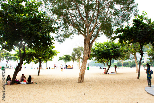 Obraz na plátne Chinese people and foreigner travelers travel relax on the beach and swimming in