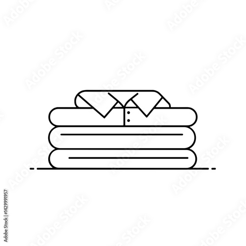 Folded shirt stacked neatly on clean towels  