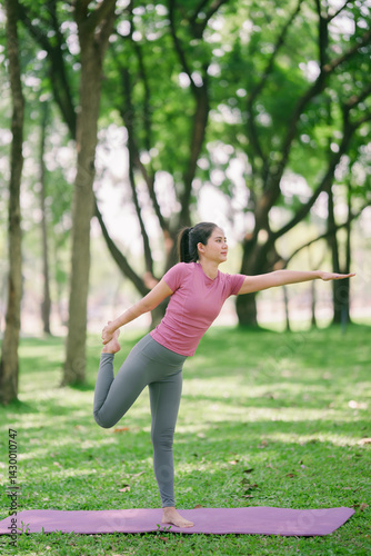 Photography .A fit woman is doing yoga by stretching her legs for health and to reduce injur