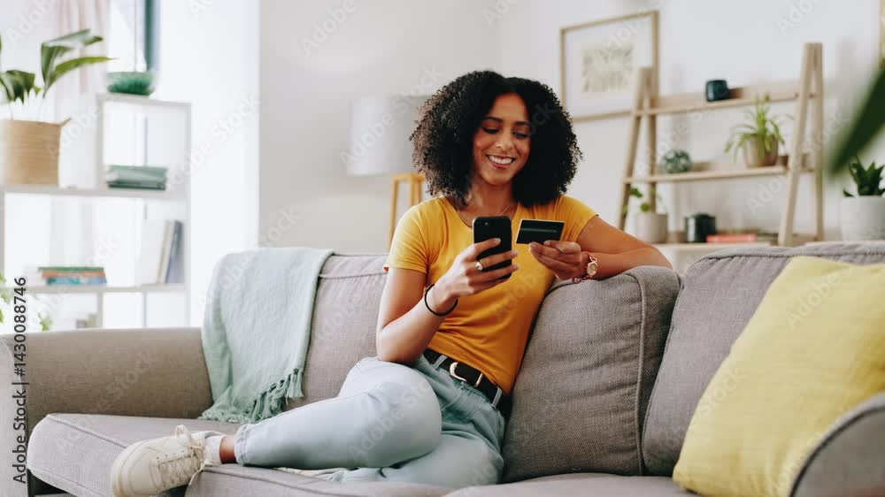 Woman, phone and happy with credit card on sofa for online shopping, banking purchase and easy transaction. African person, relax and smile with smartphone for digital payment and ecommerce in home