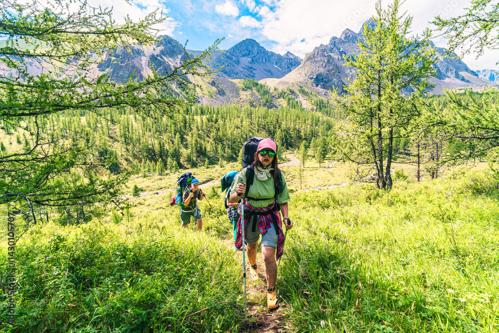 Mother and sons hikers adventuring trip in the back country. The silence around me awakens senses. Some of best life memories are hikes.