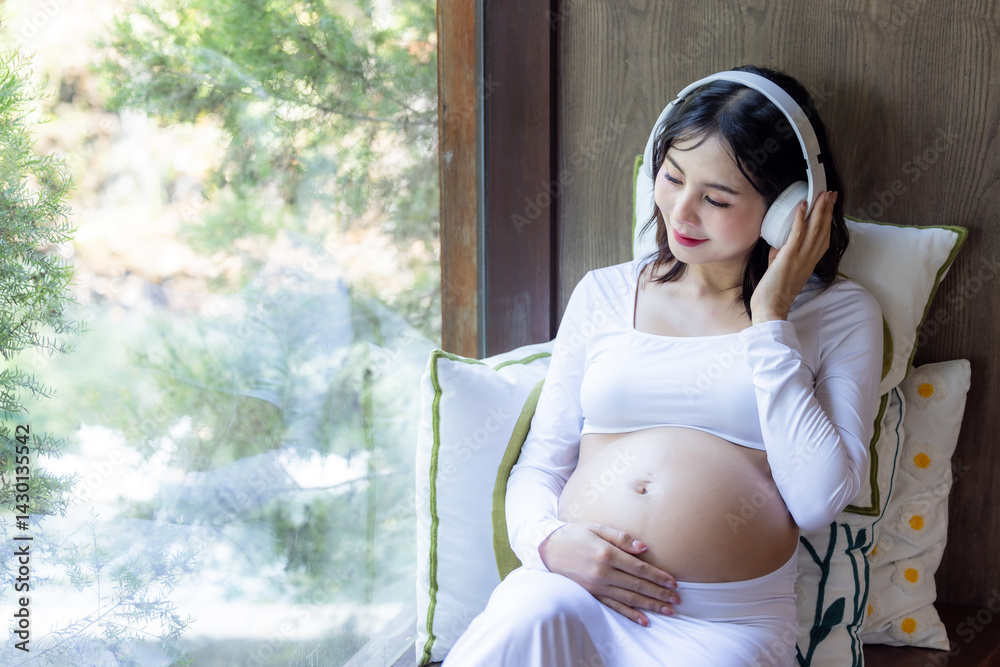 Happy asian pregnant woman listen music and lying, Asian pregnant woman use headphones listen music for baby in belly learn and feeling relax, Pregnant woman with headphone, Motherhood and Pregnancy.