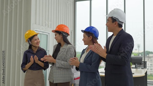 Businessmen congratulate each other on the success of sales exceeding the target, smooth business negotiations, shaking hands and applauding.