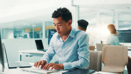 Obraz na płótnie Programmer, man and typing on computer in office for software development, code debugging and testing app. Professional, employee and technology for database troubleshooting and system maintenance w salonie