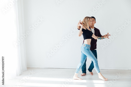 Man and woman dancing together to music photo