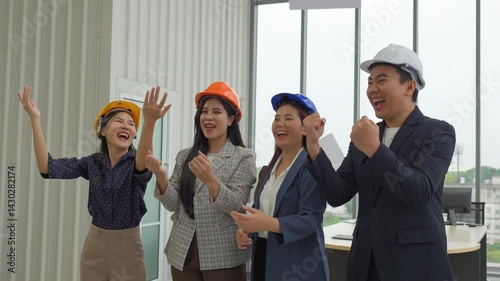Businessmen congratulate each other on the success of sales exceeding the target, smooth business negotiations, shaking hands and applauding.
