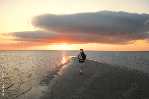 Happy young girl playing with stick horse in sand Outer Banks No photo