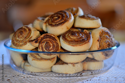 Obraz na płótnie pile of poppy seed and walnut strudels in the ceramic bowl at the table w salonie