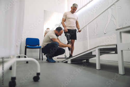 Amputee and a prosthetic technician work together to ensure optimal fit and comfort of the prosthetic device