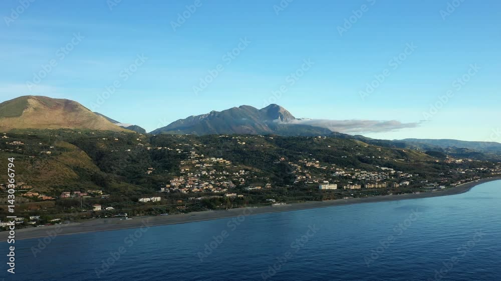 The village of Acchio - Fiumicello on the Tyrrhenian Sea in Europe, Italy, Calabria, in summer, on a sunny day. The village of Acchio - Fiumicello on the Tyrrhenian Sea in Europe, Italy, Calabria, in summer, on a sunny day.