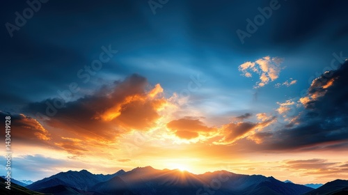 Stunning sunrise over majestic mountains with vibrant blue and orange hues.