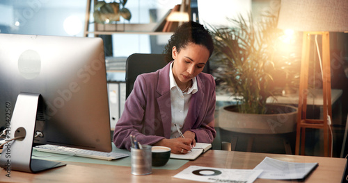 Computer, planning and writing with business woman at desk for investment or portfolio management. Agenda, finance and notebook with stock market broker in workplace for strategy development