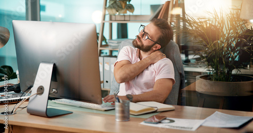 Businessman, neck pain and computer with injury for bad posture, overworked or stress at office desk. Man, employee or ache with sore joint, shoulder or inflammation for muscle tension at workplace