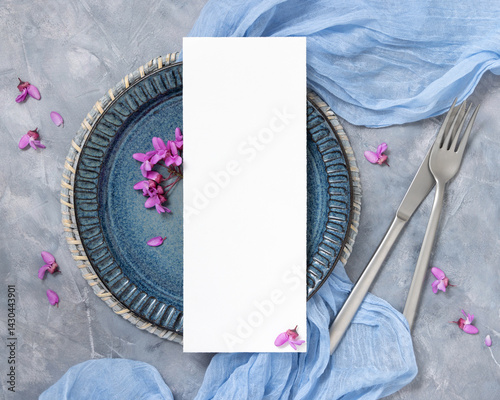 Obraz na płótnie Wedding table place with a card near fabric and wild purple flowers top view on gray, spring mockup w salonie