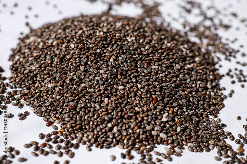 close-up of chia seeds, useful for improving digestion and saturating the body with vitamins and minerals. concept of dietetics, fitness, healthy eating. close-up of chia seeds, useful for improving digestion and saturating the body with vitamins and minerals. concept of dietetics, fitness, healthy eating.