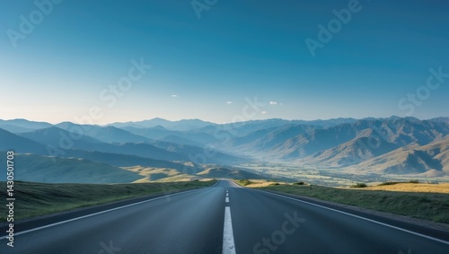 Fototapeta Naklejka Na Ścianę i Meble -  Panoramic view of an empty asphalt road in a mountain landscape with a beautiful sky