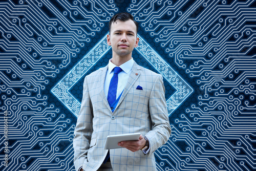 Trader man in suit holding digital tablet computer