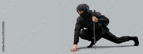 Male ninja with sword on grey background with space for text photo