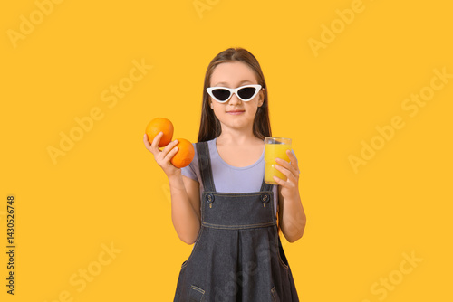 Cute little girl with orang...