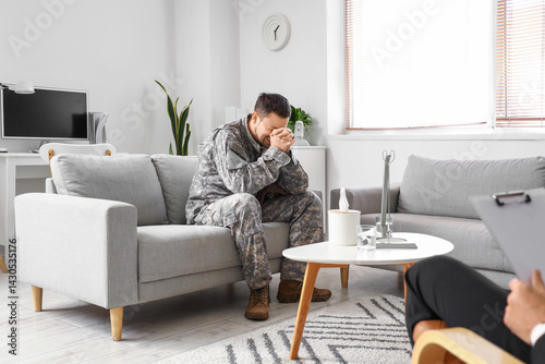 Male soldier crying at psyc...