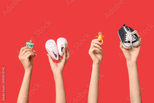 Female hands with baby boot...