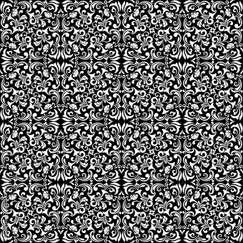 Wallpaper in the style of Baroque. White and black floral ornament. Seamless vector background. Graphic pattern for fabric, wallpaper, packaging. Ornate Damask flower illustration.