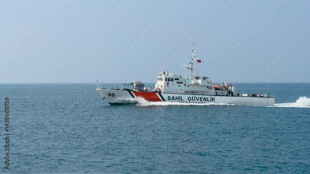 Istanbul, Fast Turkish coast guard ship patrols the Bosphorus Gulf, Sea of Marmara. Turkey, water safety. Beautiful seascape view. Boat sails along wavy calm ocean. Marine background. Istanbul, Fast Turkish coast guard ship patrols the Bosphorus Gulf, Sea of Marmara. Turkey, water safety. Beautiful seascape view. Boat sails along wavy calm ocean. Marine background.