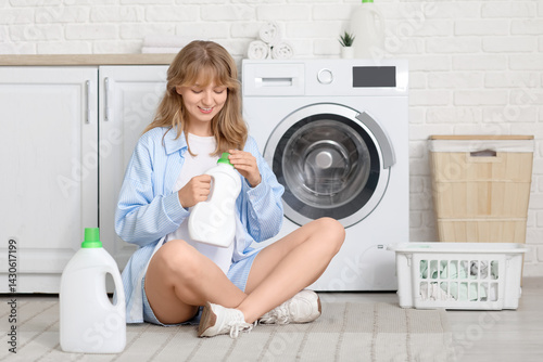 Young woman with laundry ba...