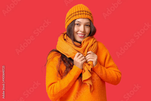 Smiling young woman in warm...
