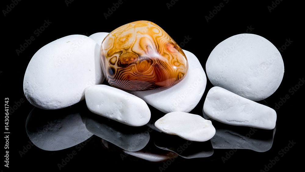 Polished Agate Stone Among White Pebbles