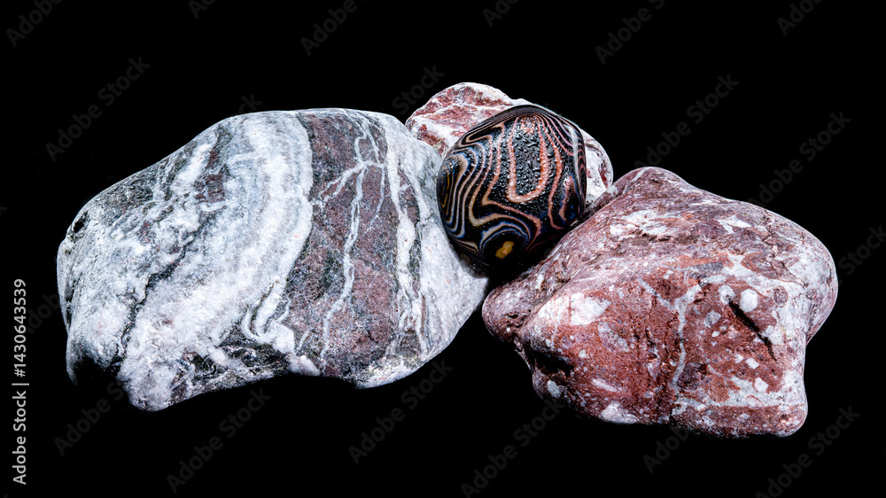 Polished agate stone on rocks