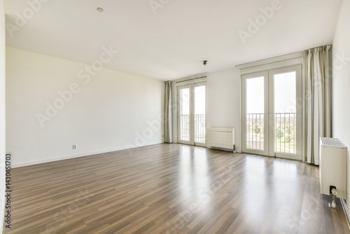 Wallpaper Mural Bright and spacious apartment interior featuring wooden flooring, large windows, and a simple, uncluttered design for a serene living environment. Torontodigital.ca