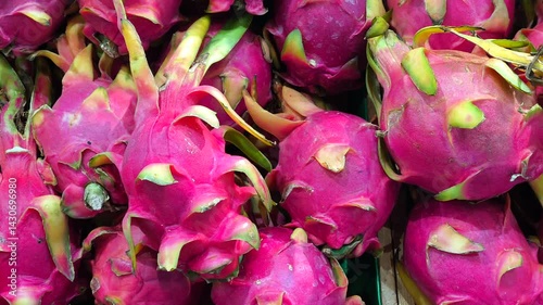 Dragon fruit is piled up in a tray in the market.