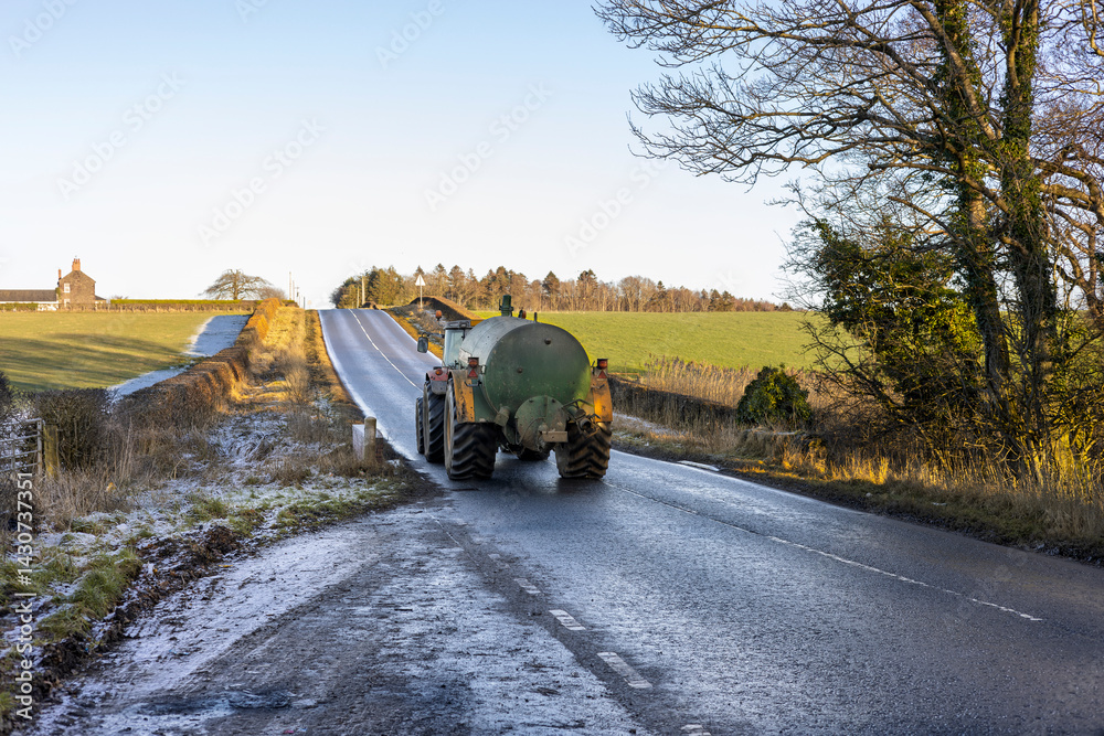 Ταπετσαρία Tractor with a Slurry Tank Driving on a Wet Country Road with Frost on Ground in