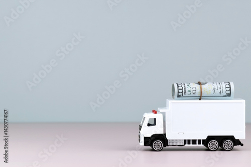 Fototapeta Naklejka Na Ścianę i Meble -  White toy truck with boxes on a light background, space for text.