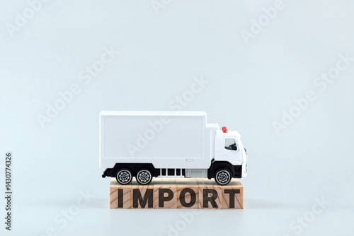 Fototapeta Naklejka Na Ścianę i Meble -  White toy truck on blocks with the text IMPORT.