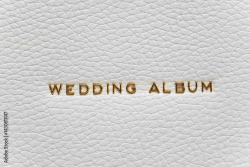 Obraz na płótnie The inscription Wedding Album in gold letters on the white leather cover of book w salonie