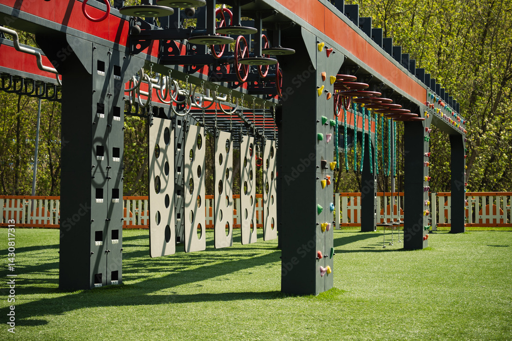 Sports ground outdoors for kids and adult. Successful training concept. Open air gym, street workout concept. Hanging monkey bars on kids playground.