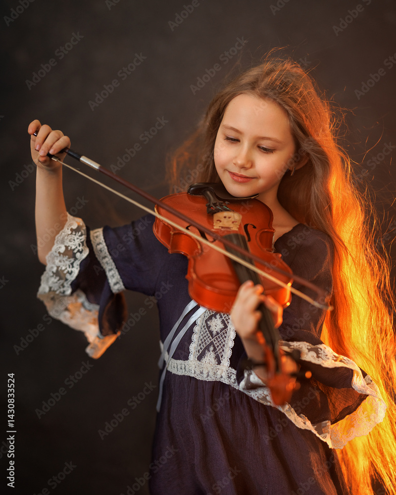 Portrait of a beautiful girl with developing long hair and a violin on a dark background in the studio. Music and art