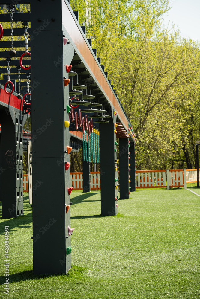 Sports ground outdoors for kids and adult. Successful training concept. Open air gym, street workout concept. Hanging monkey bars on kids playground.