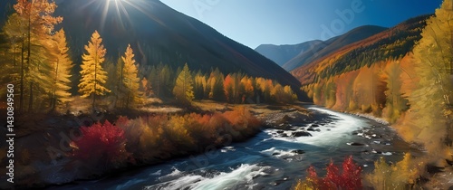 Obraz na płótnie Spectacular wide shot of mountain river flowing through vibrant autumn forest under a radiant blue sky w salonie