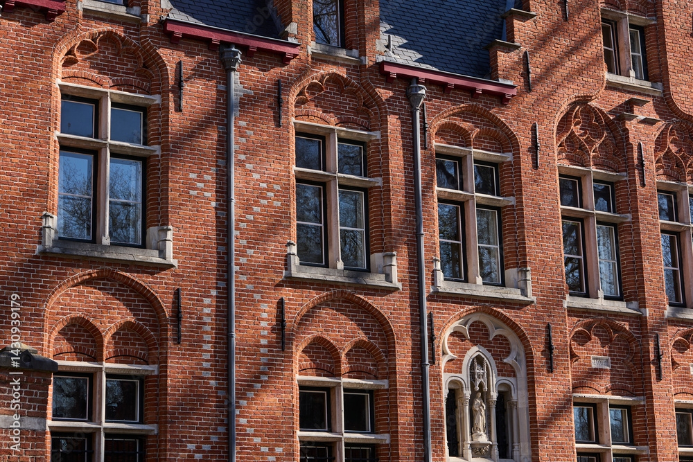 Naklejka premium historic red brick building in downtown brugge belgium