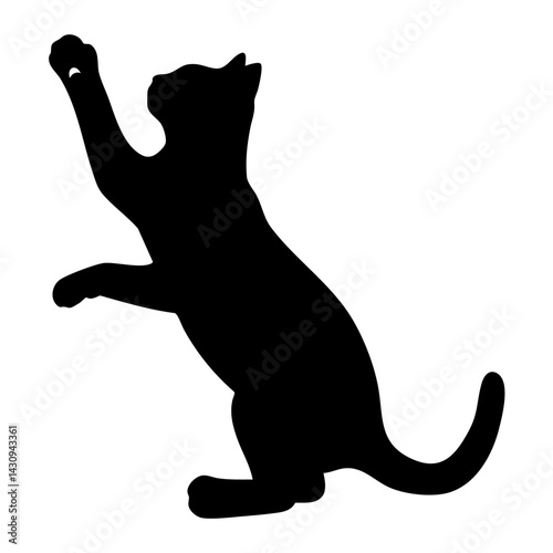 Silhouette of a playful cat reaching for a toy, showcasing its energetic pose and graceful posture.