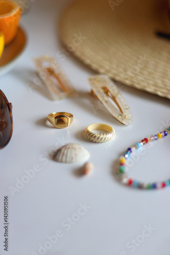 Obraz na płótnie Glass of cocktail, straw hat, sunglasses, books, fresh fruit, chocolate and accessories. Summer essentials on the table. Selective focus. w salonie